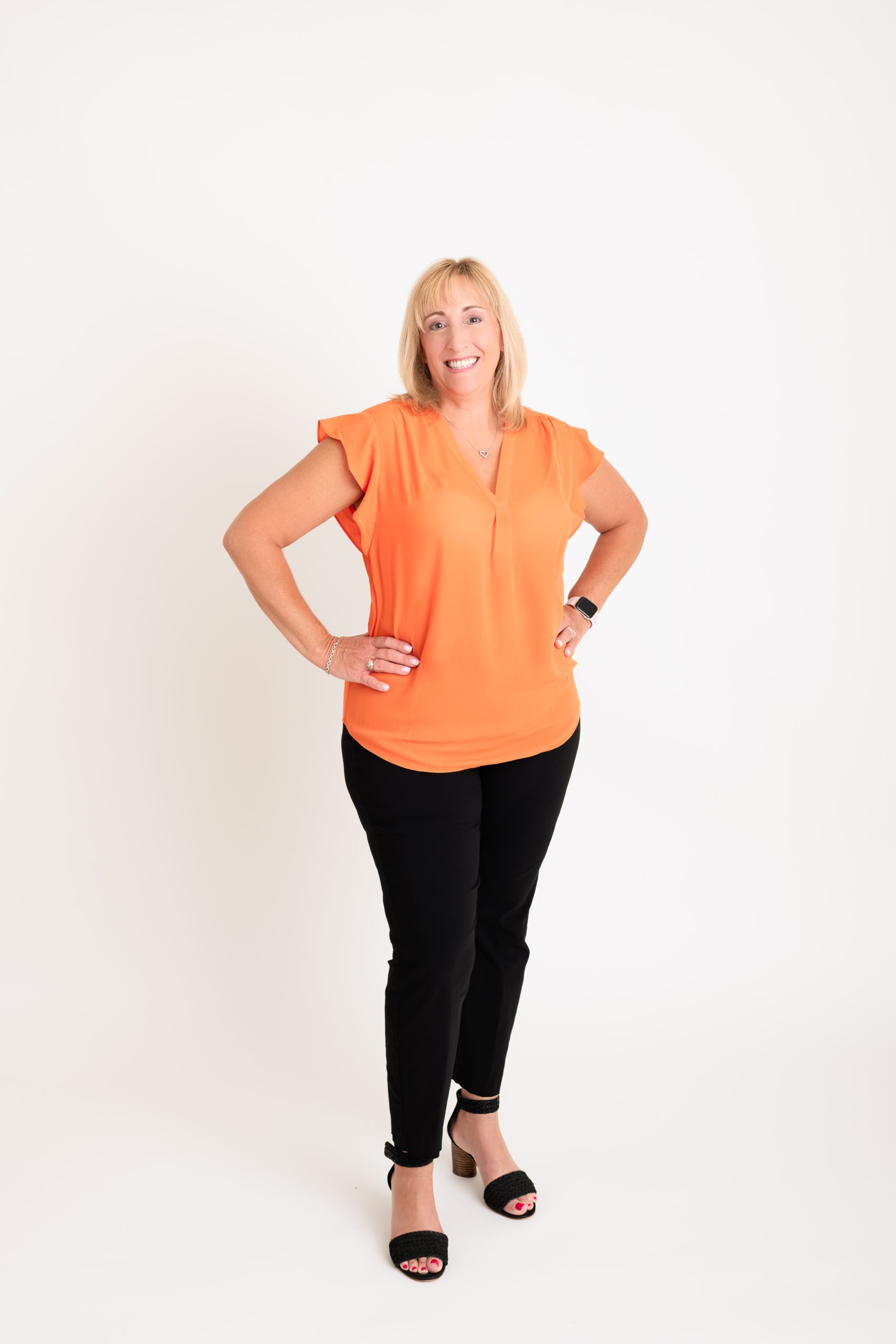 standing - orange shirt no jacket